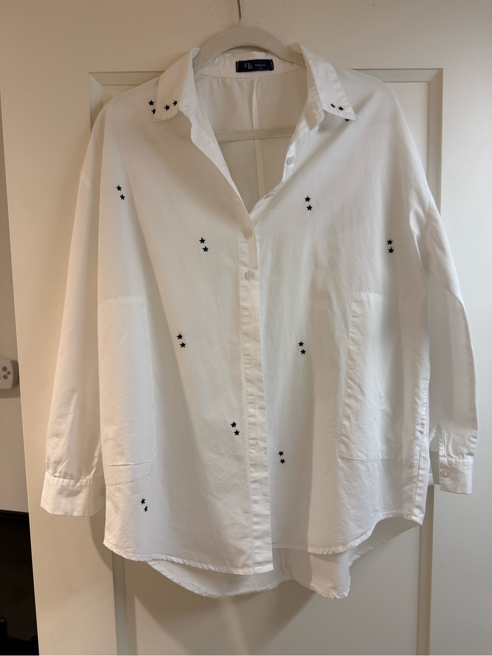White shirt with stars so cute with jeans. Great side pockets.